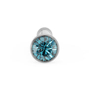 Front-facing close-up of 1.5mm blue diamond in white gold bezel setting on bone nose stud