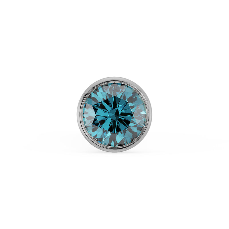 Close-up top-down view of 1.5mm blue diamond in white gold bezel setting, full sparkle detail