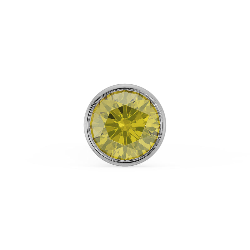 Close-up of 1.5mm yellow diamond in white gold bezel setting, top-down view showing facets