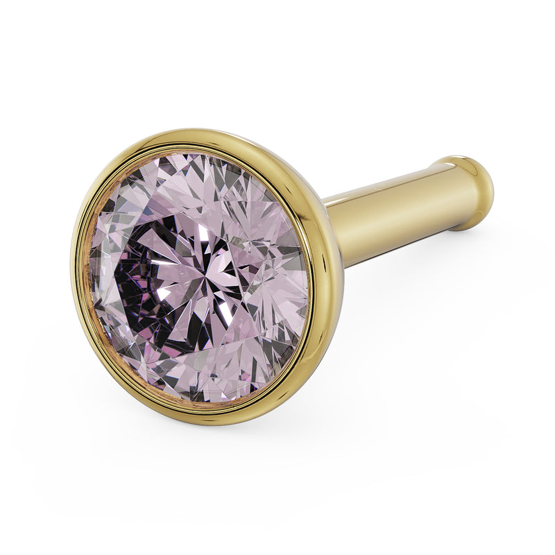 Close-up of 3mm pink diamond in 14k yellow gold bezel setting, bone post style angled view