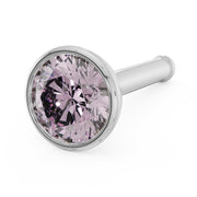 Close-up of 3mm pink diamond in 14k white gold bezel setting, bone post style angled view