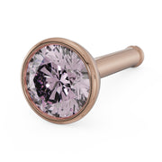 Close-up of 3mm pink diamond in 14k rose gold bezel setting, bone post style angled view