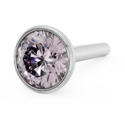 Angled close-up of 3mm pink diamond in 14k white gold bezel nose stud, straight post visible