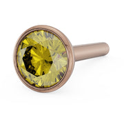 Close-up top view of 3mm yellow diamond in 14k rose gold bezel nose stud, straight post