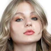 3mm diamond flat back labret stud worn as a Monroe piercing on a model, front face portrait