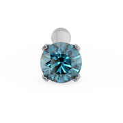 Top-down close-up of 2mm blue diamond in four-prong white gold setting on straight nose stud