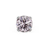 Close-up of 2mm pink diamond in four-prong white gold setting, showing faceted brilliance