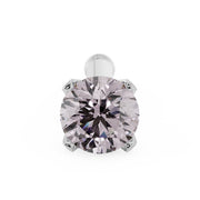 Overhead close-up of 2.5mm pink diamond in white gold 4-prong setting with bone post visible