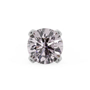 Close-up of 2.5mm pink diamond in 4-prong white gold setting, overhead view showing facets