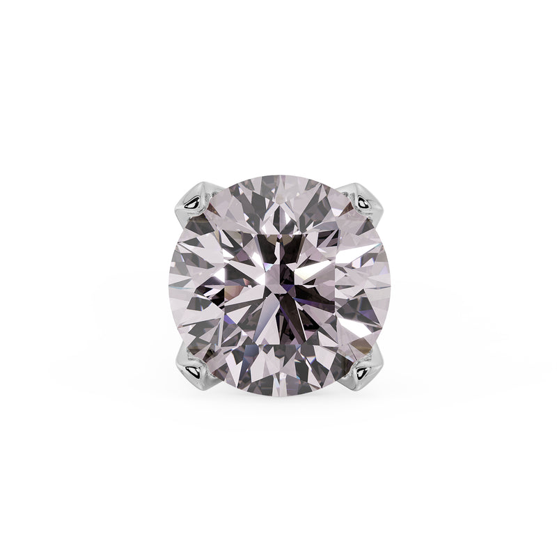 Close-up of 2.5mm pink diamond in 4-prong white gold setting, overhead view showing facets