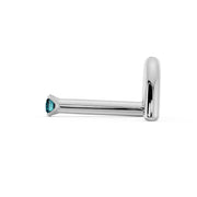 Side profile of 14k white gold blue diamond nose bone style showing flush-fit straight post