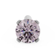 Overhead macro view of 2.5mm pink diamond in platinum 4-prong nose stud setting