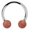 14k white gold circular barbell with pink opal ball ends, front view showing bright silver-toned finish