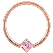 14k rose gold fixed bead ring with pink princess-cut CZ in corner-mount bezel, front view