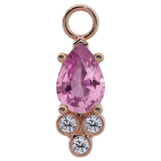 14K rose gold pear-cut pink sapphire piercing charm with three bezel-set diamond accents, front view