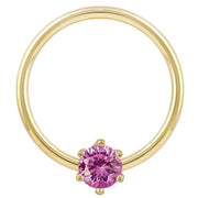 14k yellow gold fixed bead ring with round pink CZ in six-prong setting, front view
