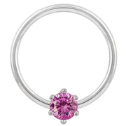 14k white gold fixed bead captive ring with pink CZ, polished band and prong detail visible