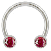 14k white gold circular barbell with dual red CZ round bezel ends, front view