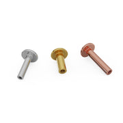 Three 14k gold flat back labret posts in white, yellow, and rose gold shown upright side by side
