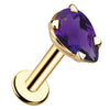 14k yellow gold pear-cut amethyst flat back labret stud, angled view showing prong setting and disc