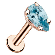 14k rose gold aquamarine pear-shaped flat back labret stud with prong setting, angled view
