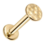14k yellow gold hammered disc flat back labret showing barbell post and flat backing, angled view