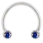 14k white gold blue cubic zirconia circular barbell, smaller diameter showing polished silver-tone horseshoe shape