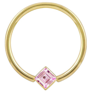 14k yellow gold fixed bead ring with pink princess-cut CZ in corner-mount bezel, front view
