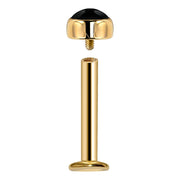 14k yellow gold flat back labret with black onyx top shown disassembled, revealing threaded post