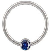14k white gold blue cubic zirconia bezel fixed bead ring, straight-on front view showing full hoop shape