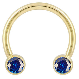 14k yellow gold circular barbell with dual blue CZ round bezel ends, front view on white background