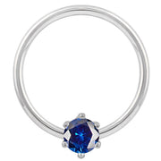 14k white gold fixed bead ring with blue CZ prong setting, polished hoop detail visible