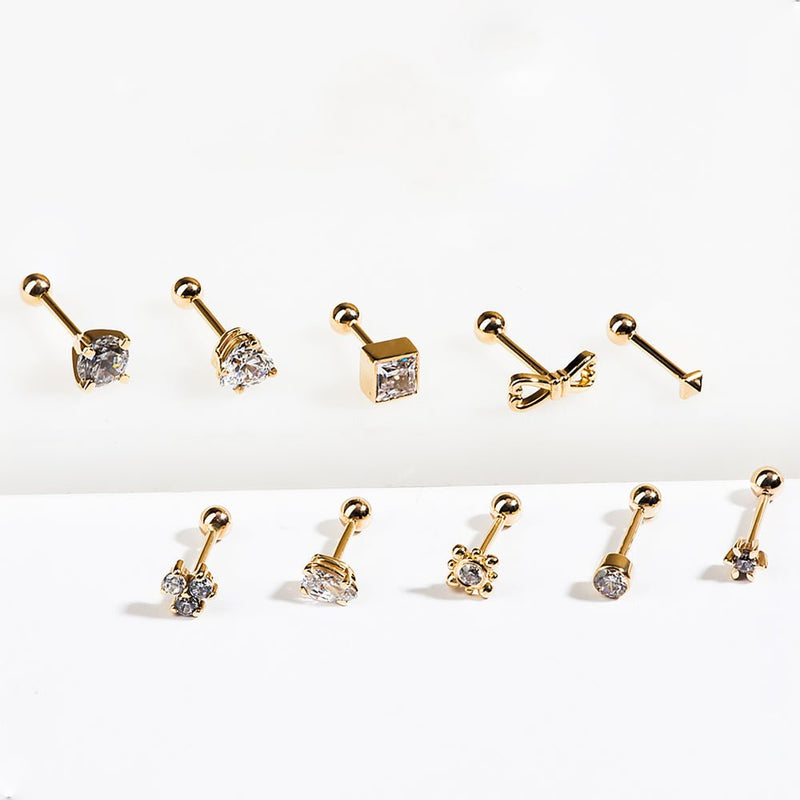 14k gold cartilage stud collection showing bezel CZ alongside other gold barbell stud styles