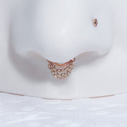 14k rose gold chain clicker hoop shown as septum ring on nose model, close-up