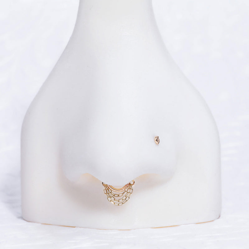 14k yellow gold chain clicker hoop styled as septum piercing jewelry on mannequin
