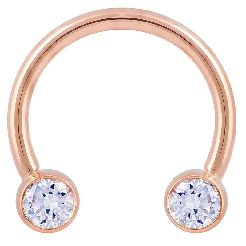 14k rose gold circular barbell with large bezel-set CZ ends, 12G front view on white background