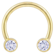 14k yellow gold circular barbell with larger 4mm bezel-set CZ ends, 12G front view