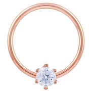 14k rose gold CZ fixed bead ring, larger hoop diameter showing warm rose tone and prong-set CZ