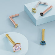 Assorted colored diamond prong nose ring studs in rose gold, yellow gold, and white gold styles