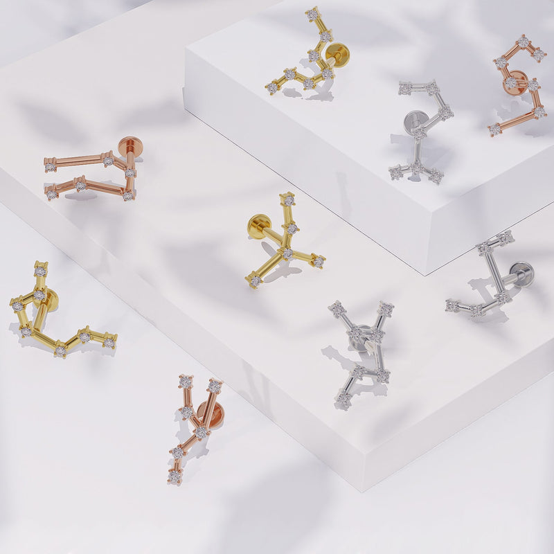 14k gold constellation flat back labret earrings in yellow, rose, and white gold, multiple zodiac styles displayed