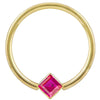 14k yellow gold fixed bead ring with red princess-cut CZ in corner-mount bezel, front view