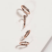 14K rose gold four-diamond seam rings in four sizes displayed on white marble surface