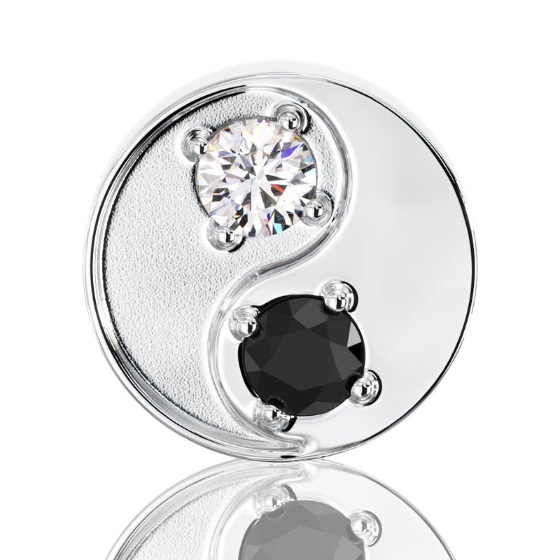 Close-up front view of 14k white gold yin yang stud highlighting prong-set black and white diamonds
