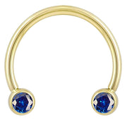 14k yellow gold blue CZ circular barbell, smaller diameter front view showing bezel-set round-cut stones