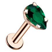 14k rose gold flat back labret with pear-cut genuine emerald in prong setting, angled product view
