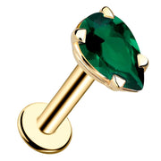 14k yellow gold flat back labret with pear-cut genuine emerald in prong setting, angled product view