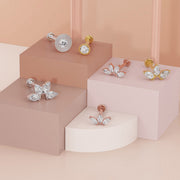 Diamond milgrain flat back studs styled with marquise crystal labrets across white gold and gold tones
