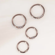 14K rose gold diamond seamless hoop rings in four sizes laid flat, showing prong-set diamond detail