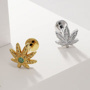 14k yellow gold and white gold emerald pot leaf flat back earrings side by side on white surface