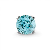 Close-up of genuine blue zircon gemstone in four-prong setting showing aqua faceted brilliance